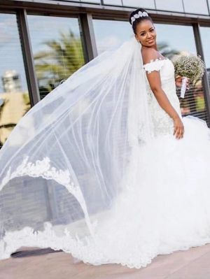 Mermaid Sleeveless Chapel Train Tulle Bridal Gown With Pearls