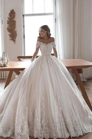 A-line Off-the-shoulder Long Sleeves Chapel Train Tulle Wedding Gown With Lace