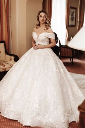 Off-the-shoulder Long Sleeves Court Train Tulle Wedding Gown With Ruffles