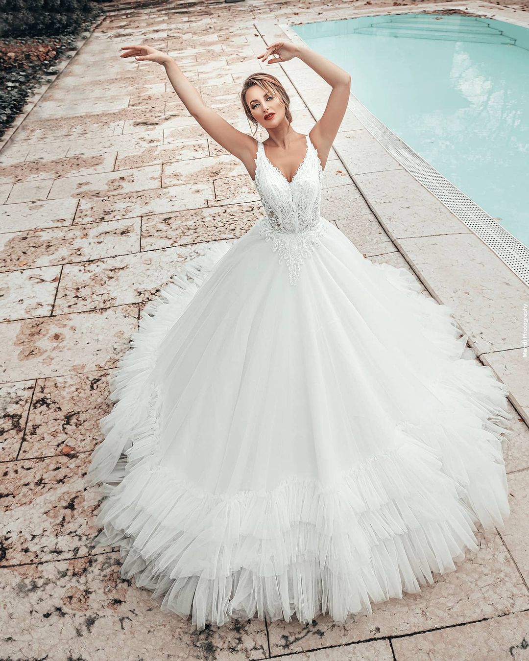 A-line Spaghetti Straps Sleeveless Sweep / Brush Train Tulle Wedding Gown With Ruffles 2