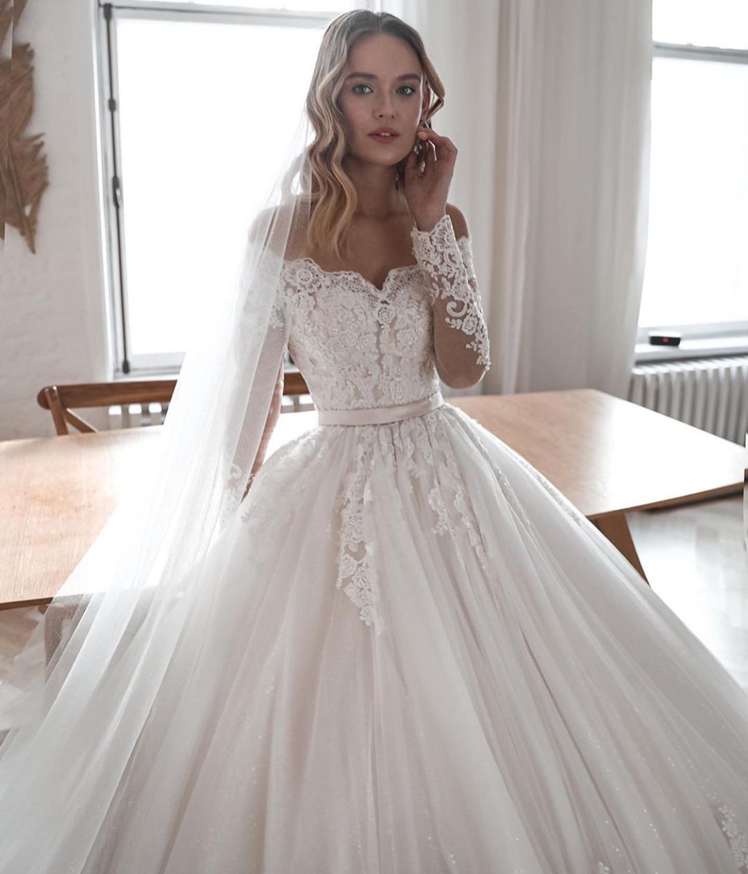 A-line Off-the-shoulder Long Sleeves Chapel Train Tulle Wedding Gown With Lace 3